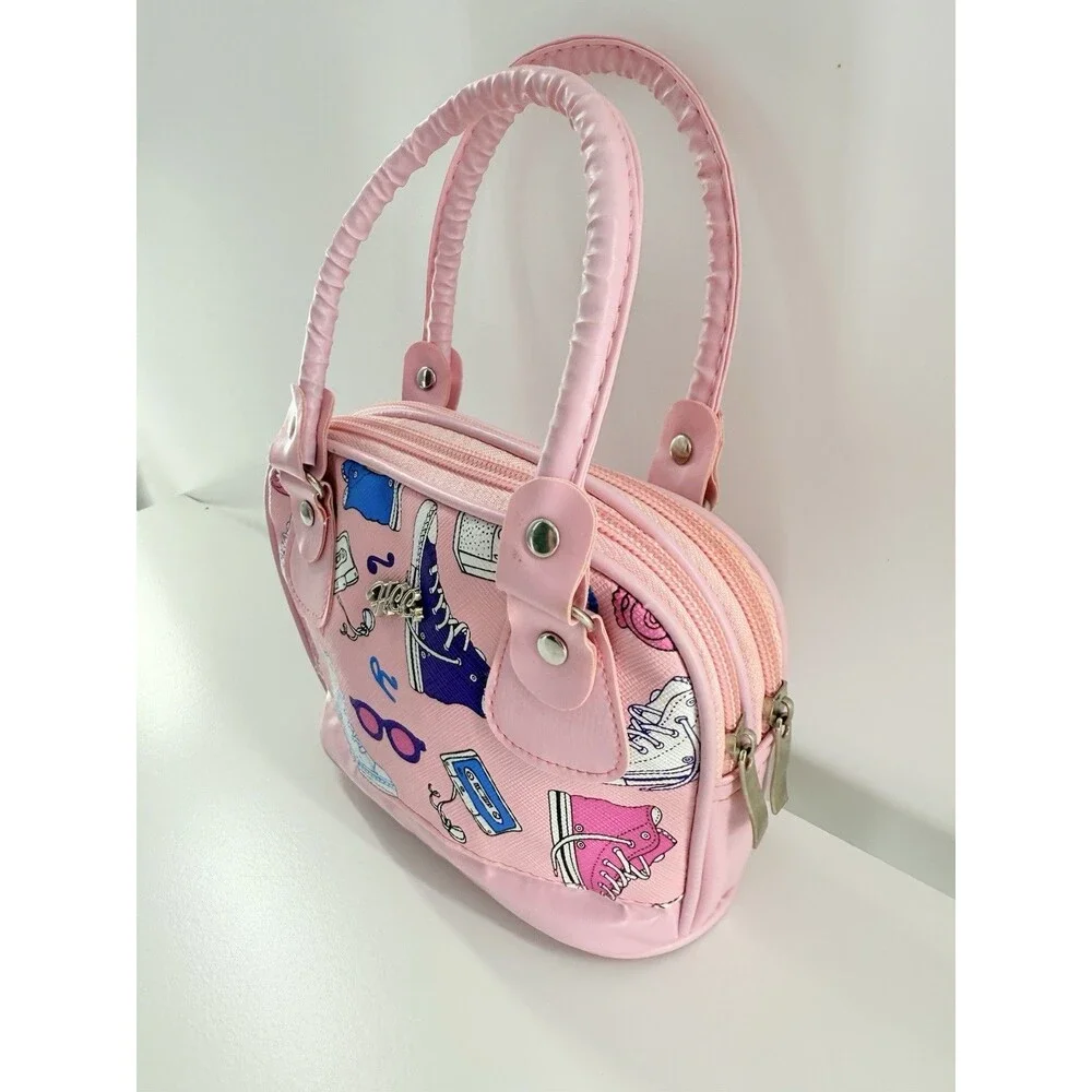 HCC Small/Mini Handbag pink with a print of sneakers, cameras, & cassette tapes